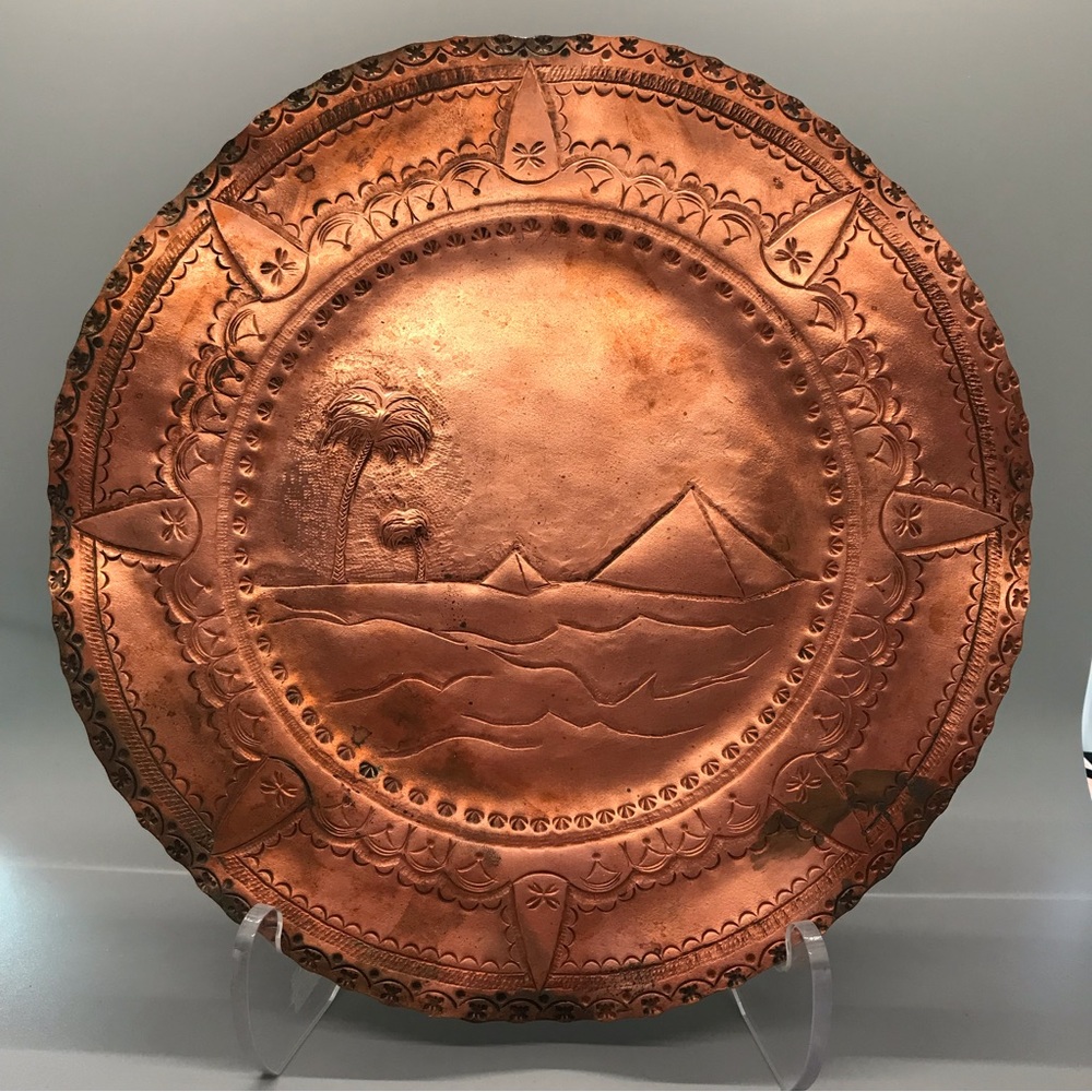 Very thick solid copper Islamic plate with the pyramids on it.